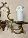 Louis XV style two-light bronze wall light with antique tassels
