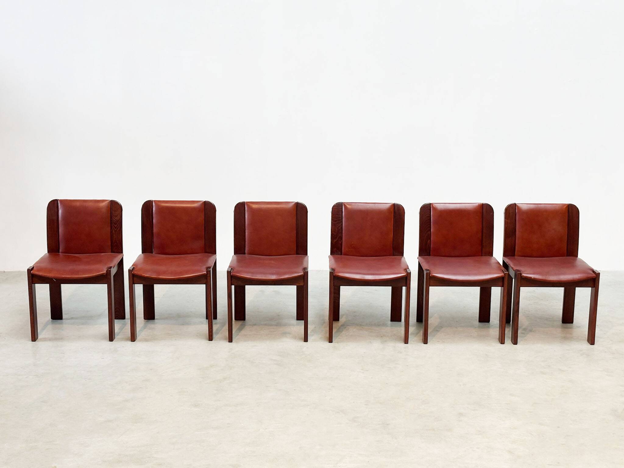 Set of six leather Italian dining chairs
