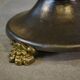 Neo-classical cast iron and glass eglomisé coffee table from the 1940s.