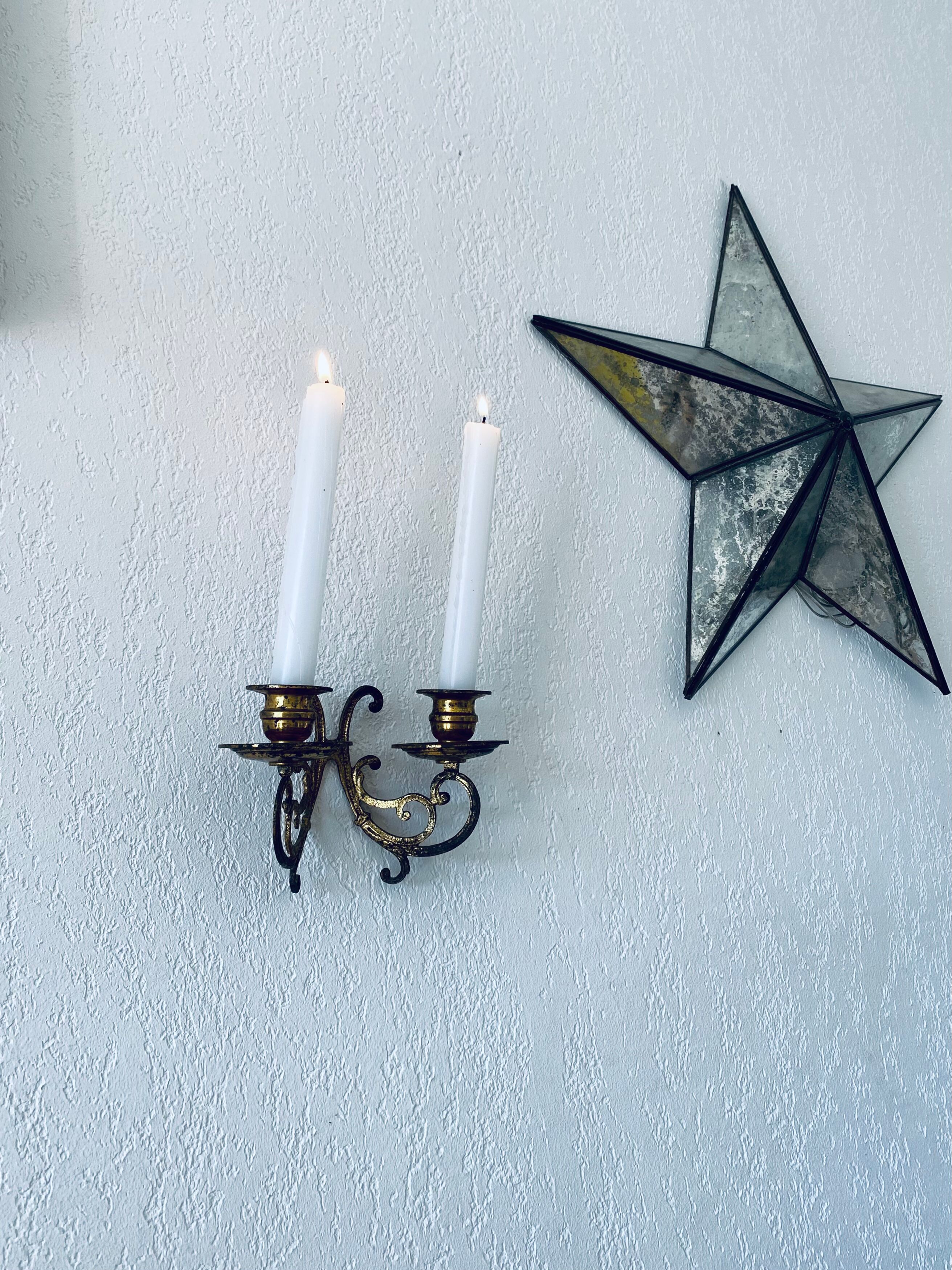 Old wall candle holder in golden brass