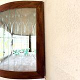 Art Deco-style wall-mounted display cabinet with floral engraving