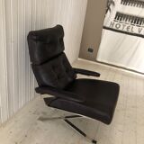 Grained leather armchair with rocking movement