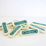 Set of twelve turquoise ceramic knife holders