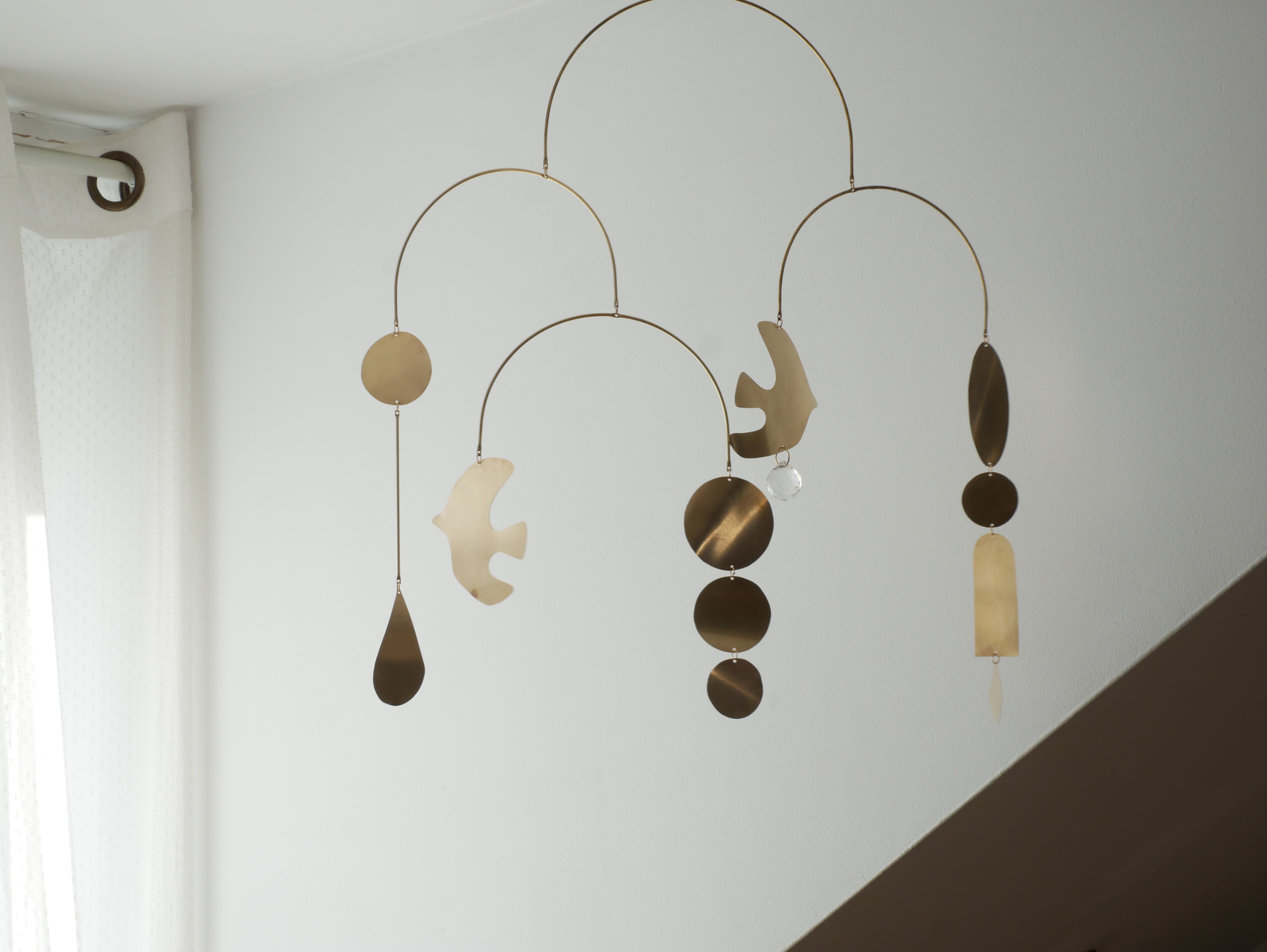Mobile model Rana . Mobile in abstract brass.