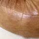 Two-seater leather pouf sofa by Raphaël Raffel for Honoré Paris