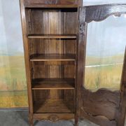 Small oak display cabinet with one door.
