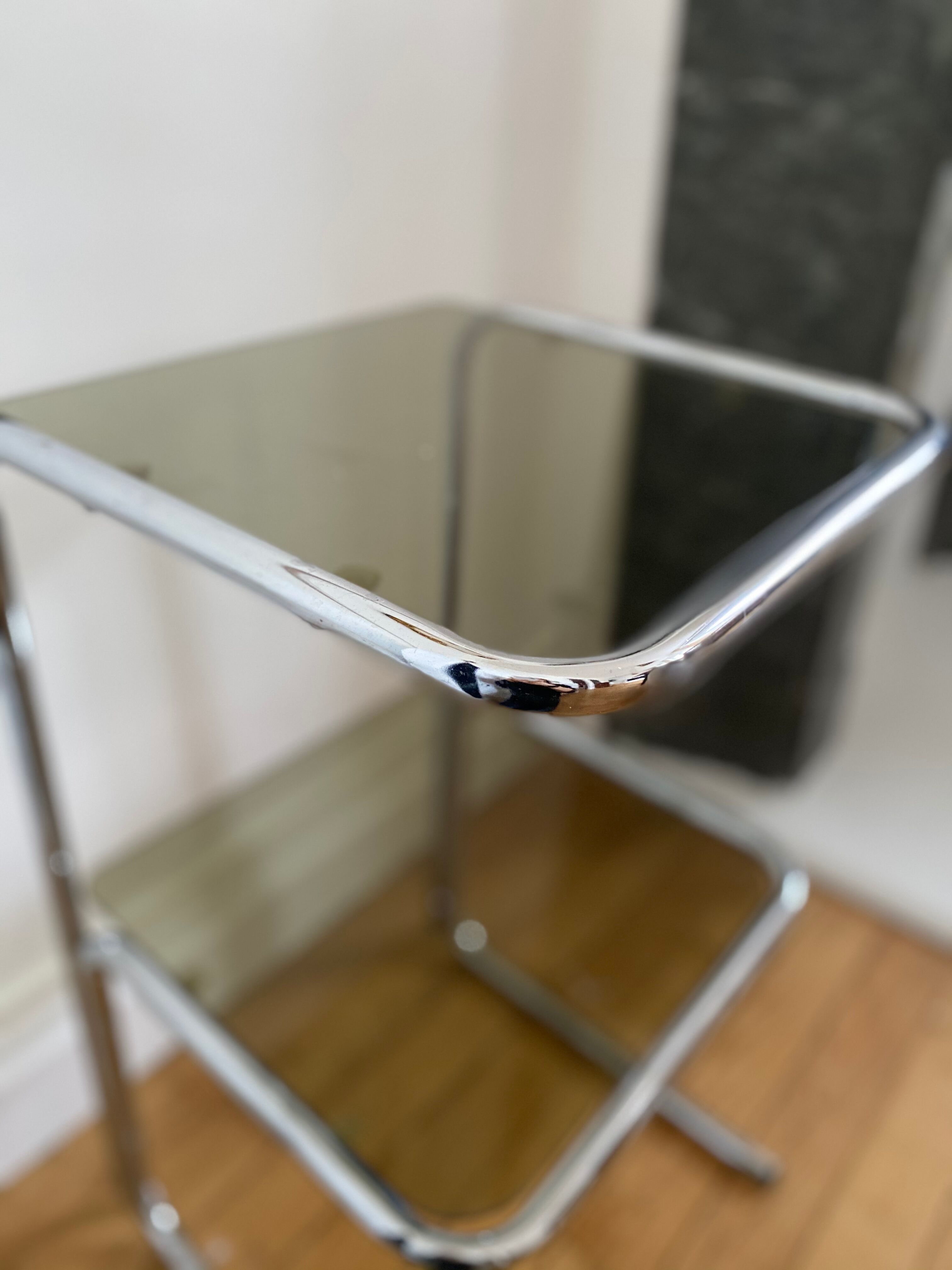 Chrome metal table and smoked glass