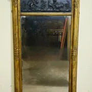 Large antique gilded wooden mirror with terracotta relief from the Empire period.