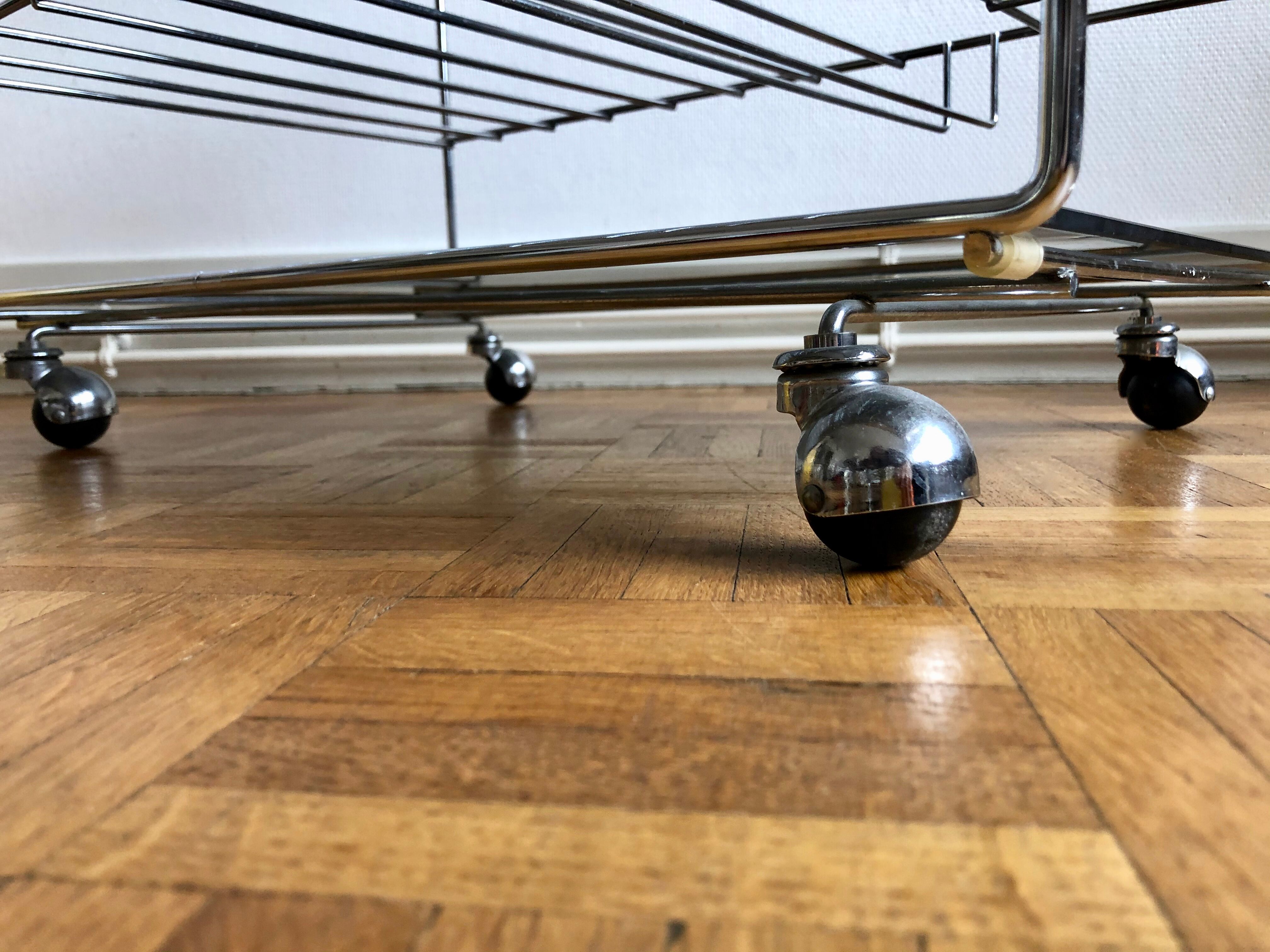 Glass and chrome wheeled vinyl holder