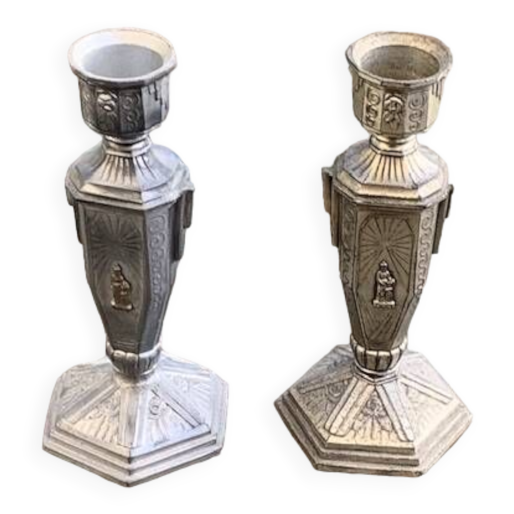 Pair of metal candlesticks, chiseled with a statuette in front, rose pattern in relief, art deco
