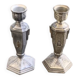 Pair of metal candlesticks, chiseled with a statuette in front, rose pattern in relief, art deco