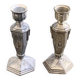 Pair of metal candlesticks, chiseled with a statuette in front, rose pattern in relief, art deco