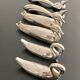 6 various animal shaped knife holders in silver metal