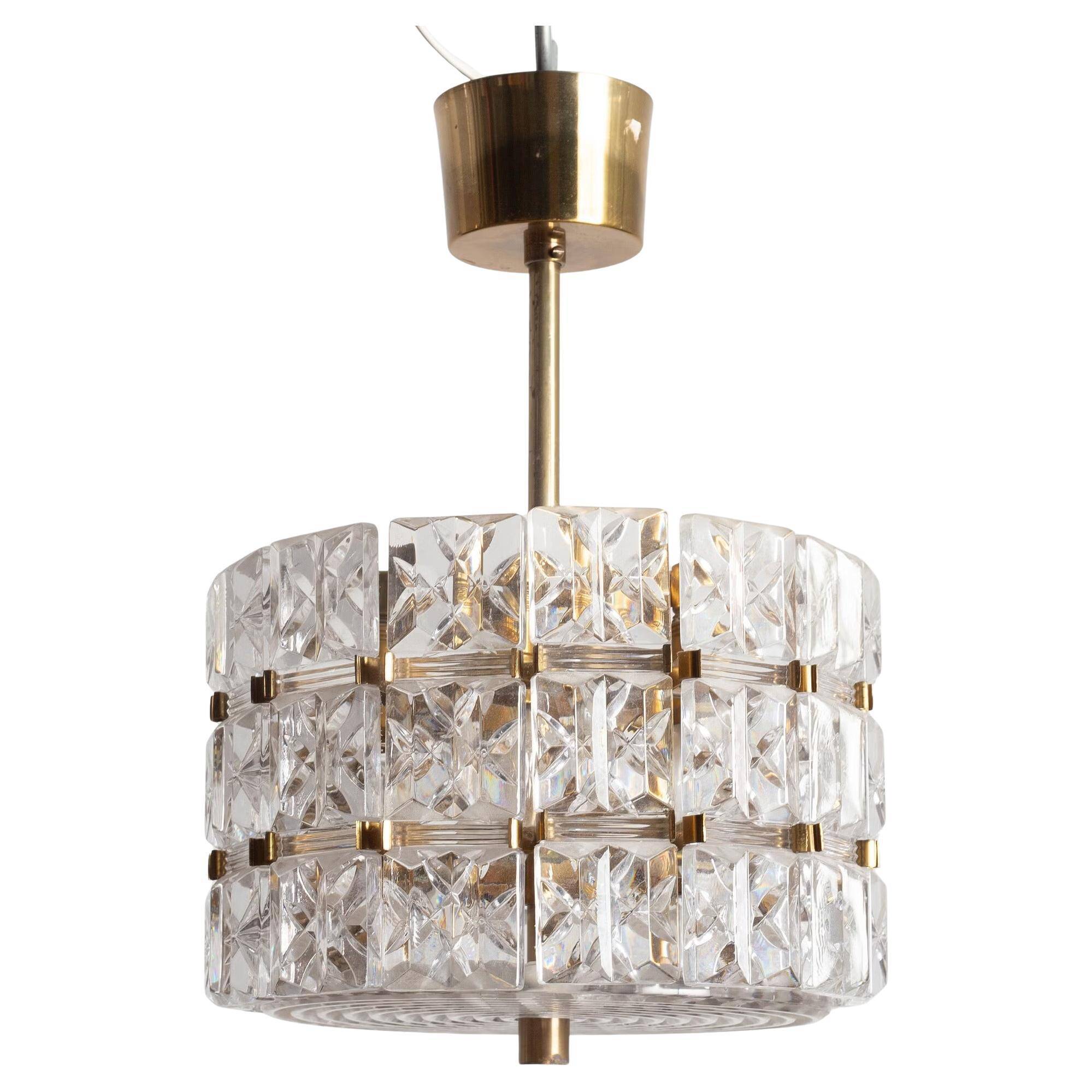 Suspended glass and brass lamp by Carl Fagerlund for Orrefors, Sweden, 1960.
