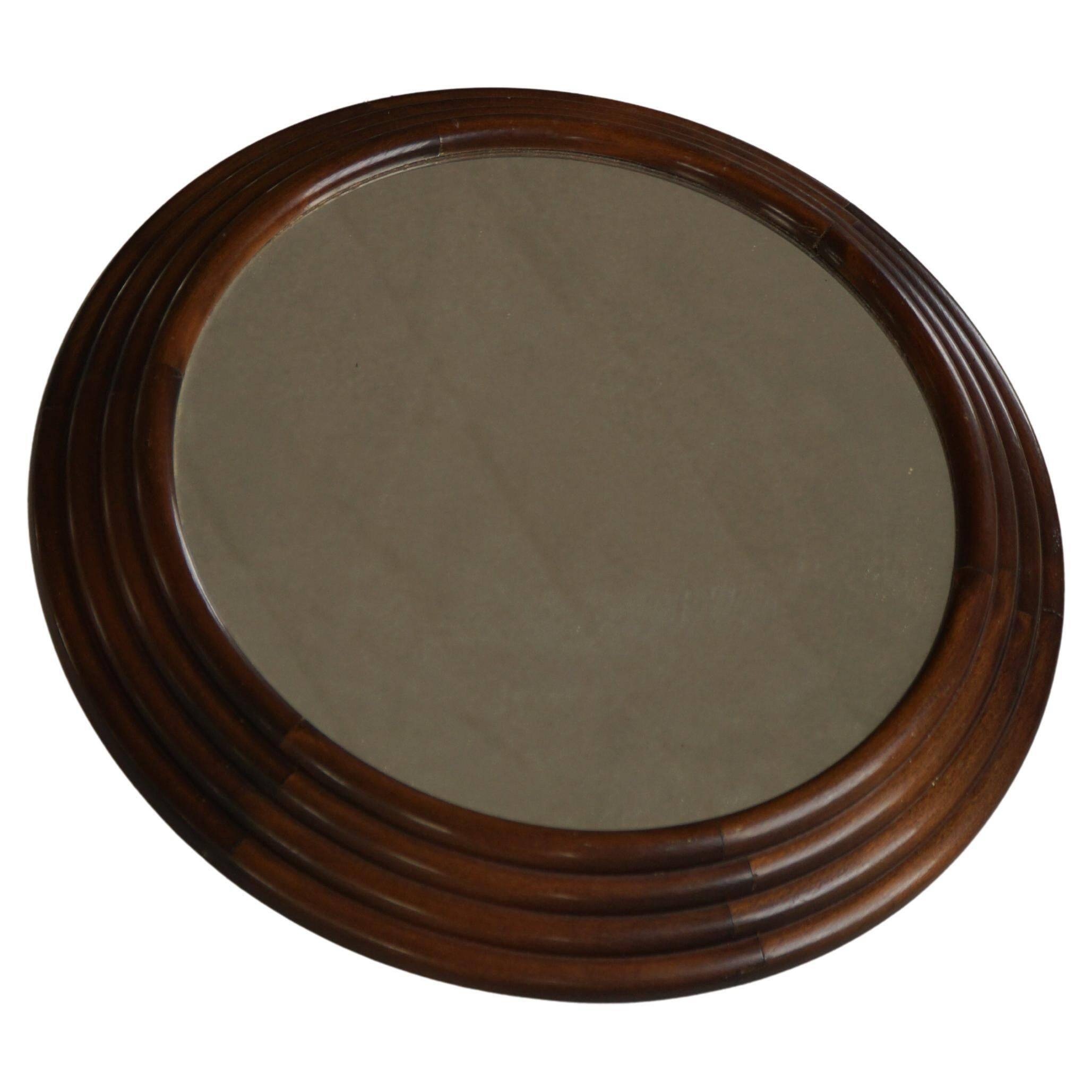 Round wooden wall decorative mirror, carved frame, mid-20th century, 1950s.