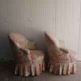 pair of toad armchairs in floral fabric.