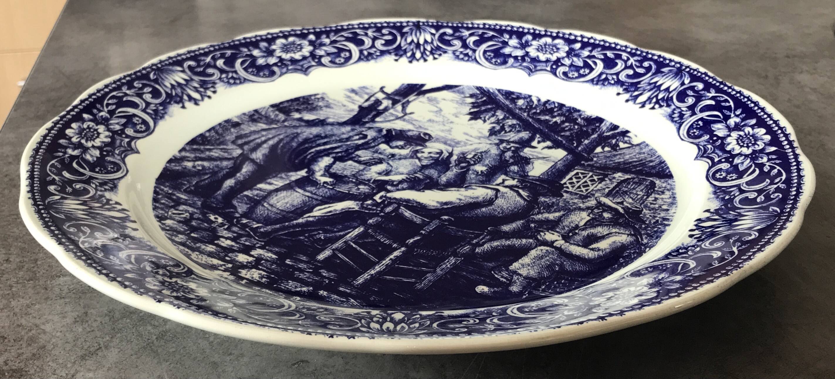 Blue enamelled earthenware wall dish with peasant scene decor Boch La Louvière