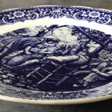 Blue enamelled earthenware wall dish with peasant scene decor Boch La Louvière
