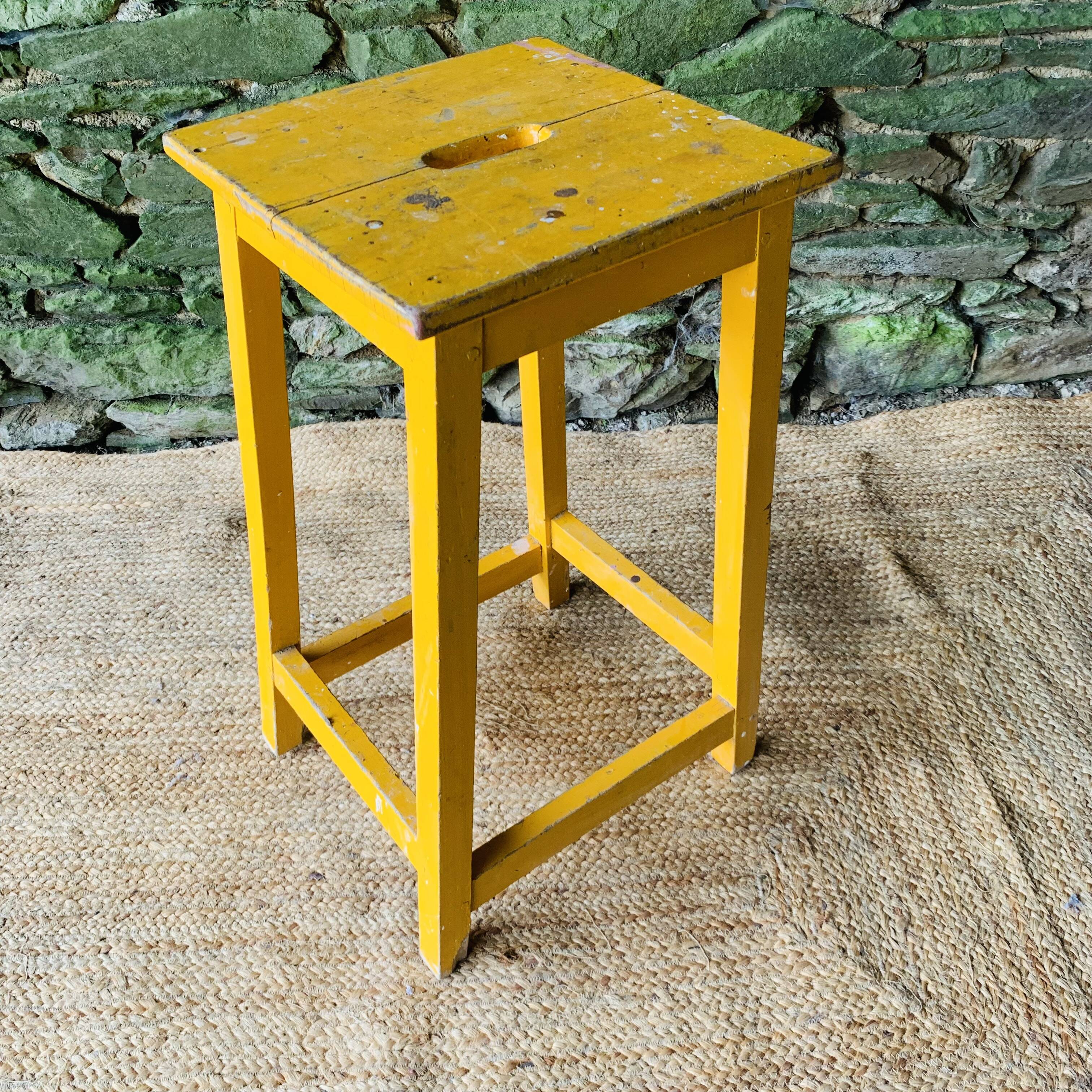Yellow wooden high stool