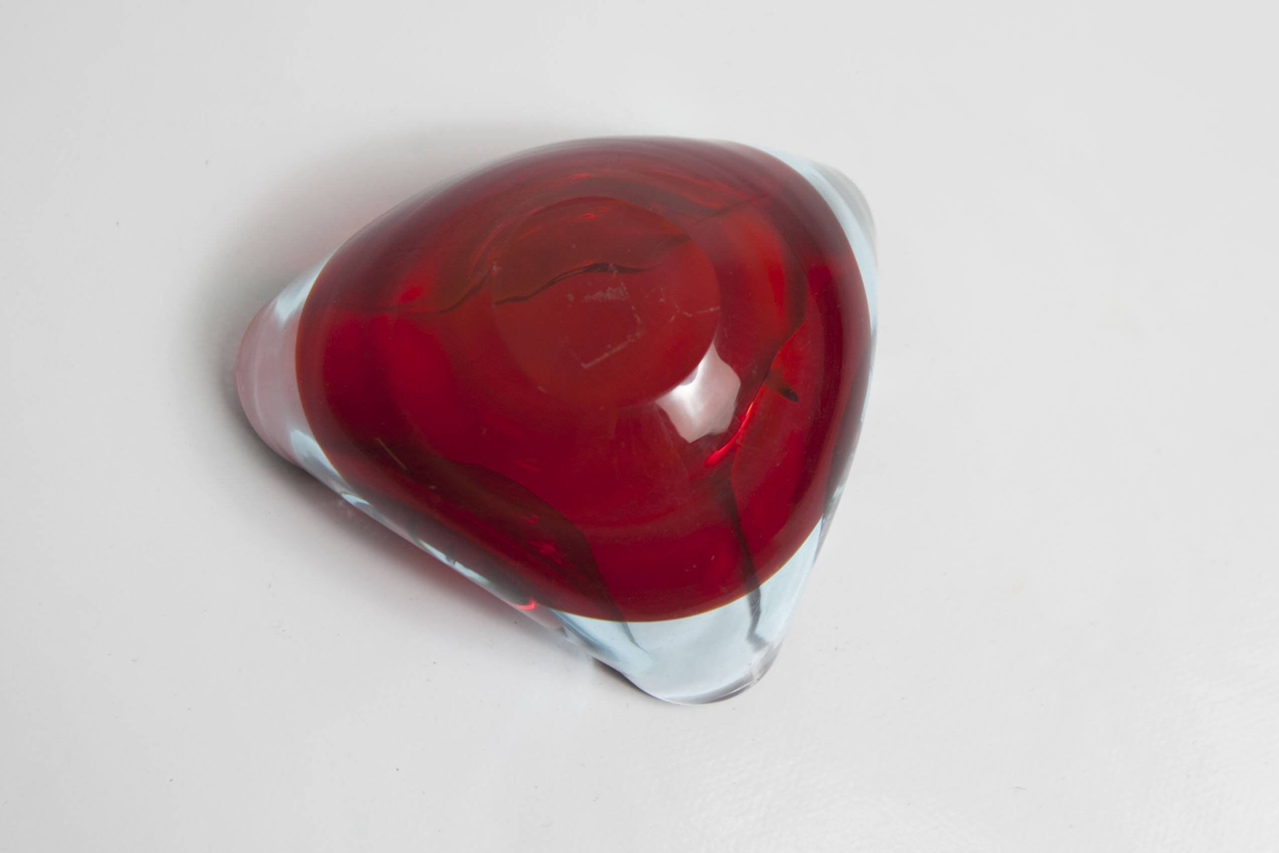 Asymmetrical ashtray murano red and transparent background 1960