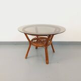 Vintage round smoked glass and rattan coffee table from the 70s