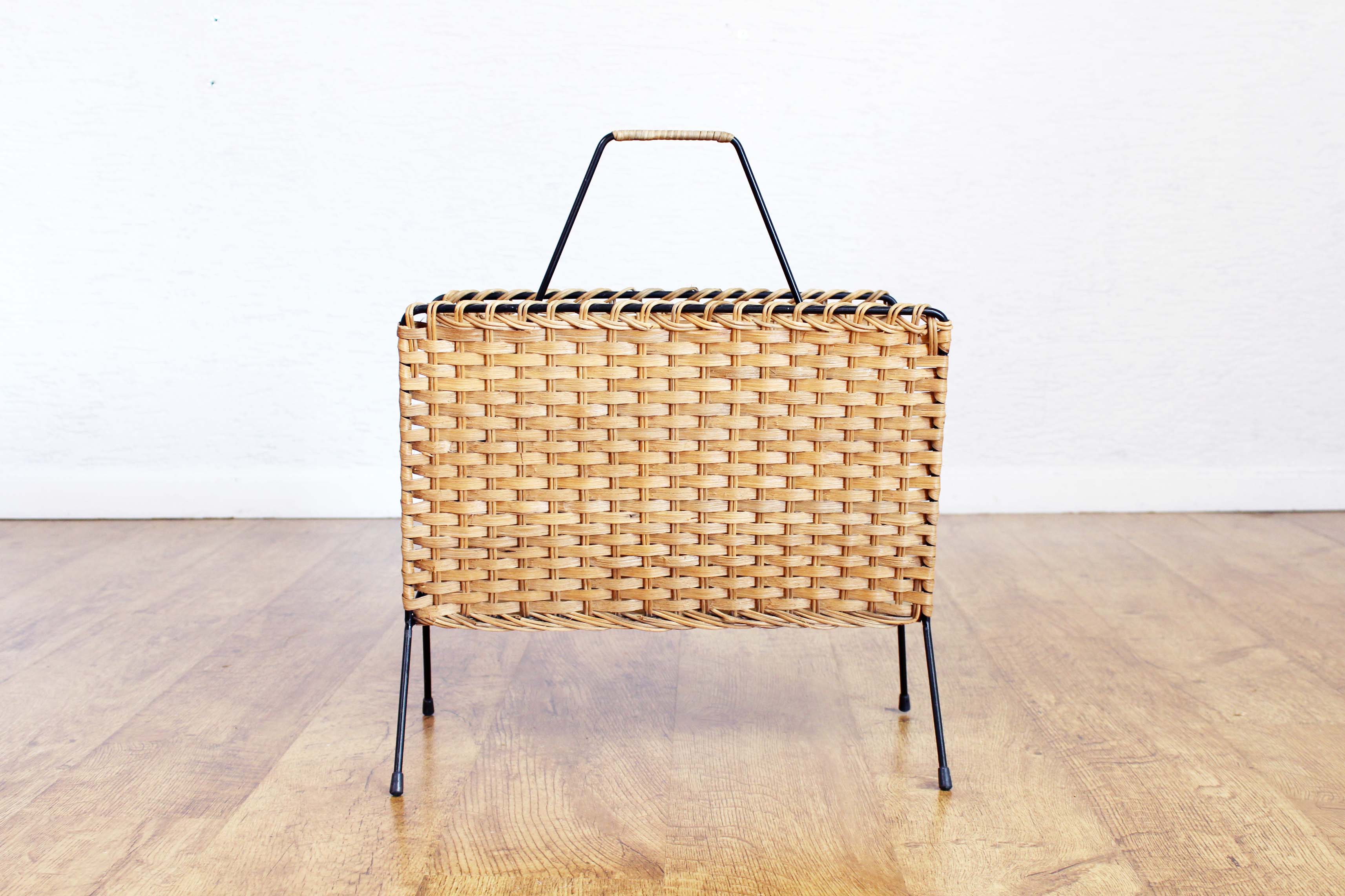 Vintage wicker magazine rack