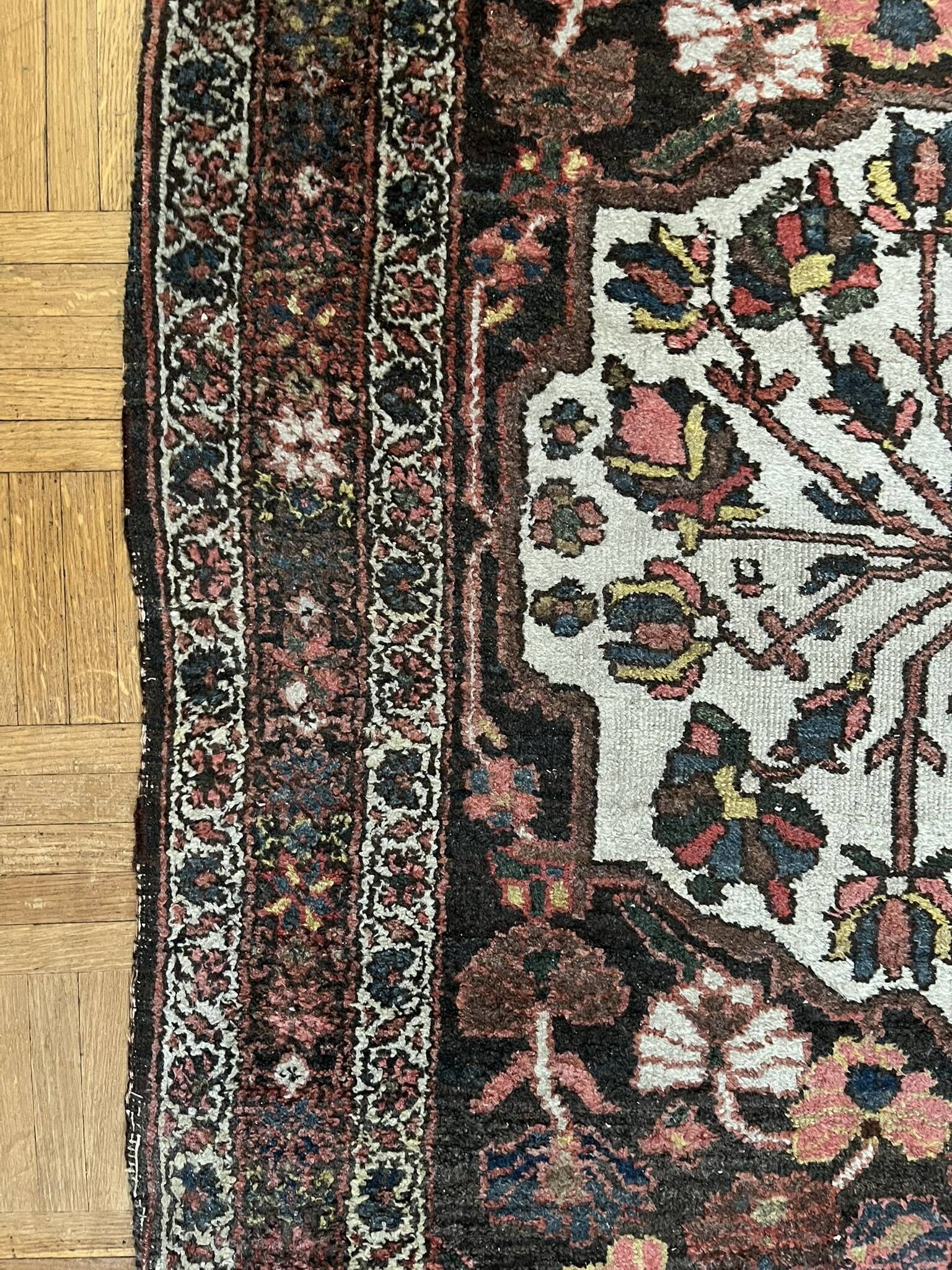 Antique handmade Hamadan Persian rug, ivory medallion on dark background 148x103.