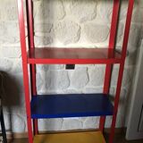 Shelf on multi-colored metal feet