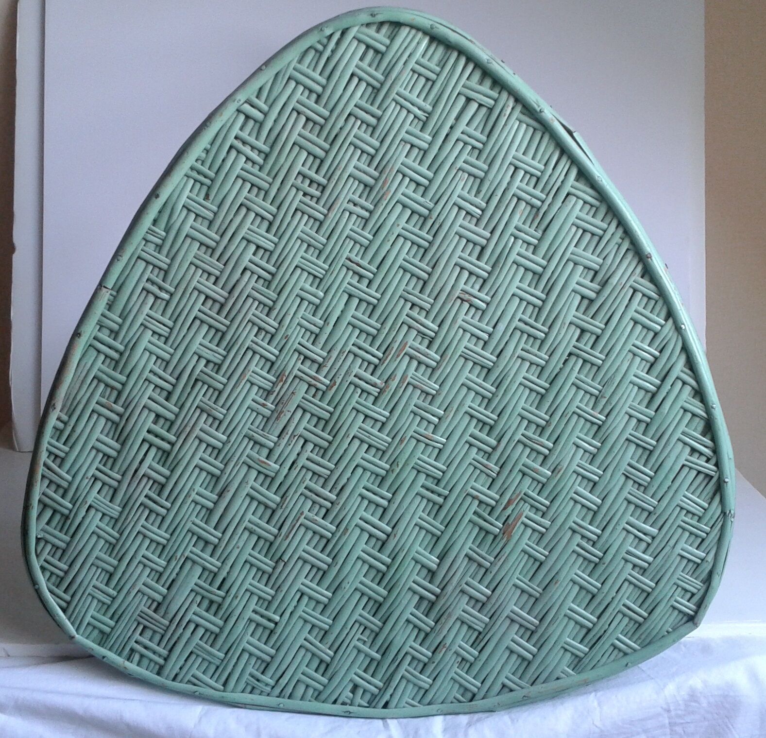 Triangular wooden and braided wicker coffee table