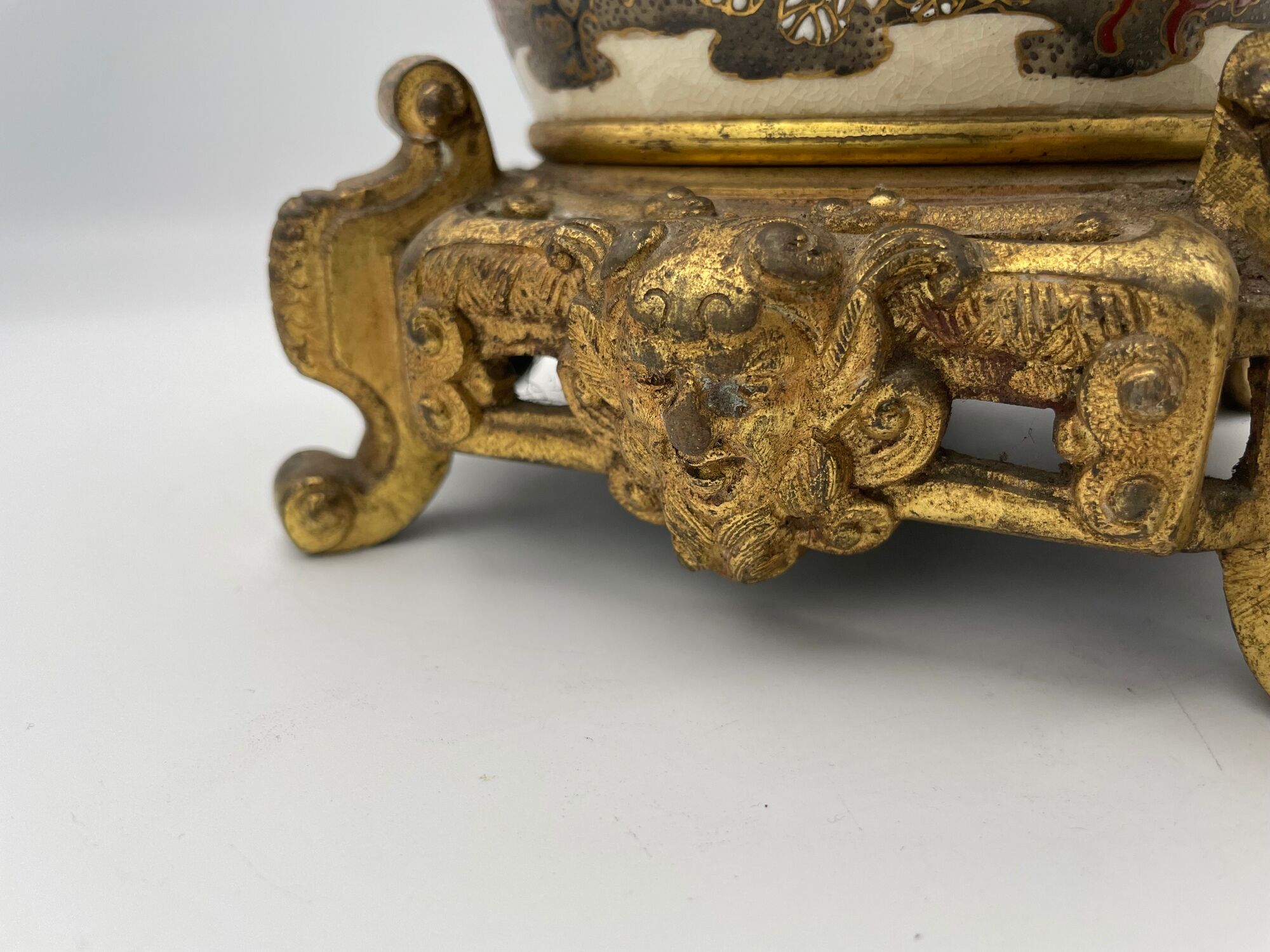 Old satsuma ceramic vase with various decorations mounted on bronze