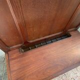 Antique wooden coat rack with mirror and shelf.