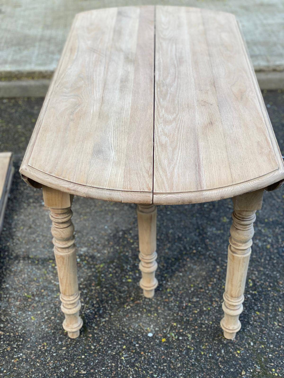 Renovated Louis Philippe round extendable dining table with 4 leaves.