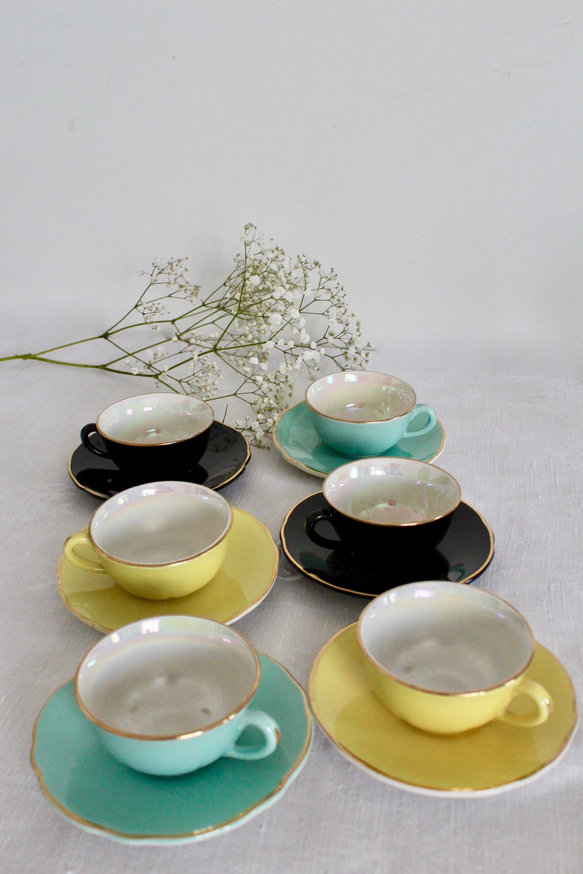 6 multicolored cups and saucers, pearly interior
