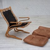 Fauteuil norvégien des années 1970, modèle "Kengu", cuir de meuble.