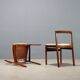 Vintage lounge chairs in exotic wood and fabric, 1960s design.