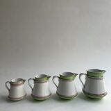 Series of 4 small pitchers.
