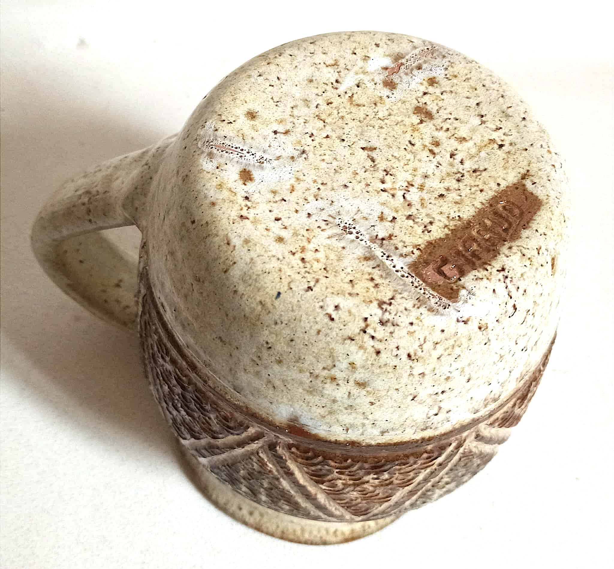 Stoneware pitcher stamped Giraud. Height 18.5 cm