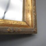 Small old mirror in wood and gilded stucco