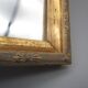Small old mirror in wood and gilded stucco