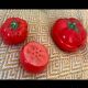 Vintage earthenware set – tomato salt and pepper shakers.