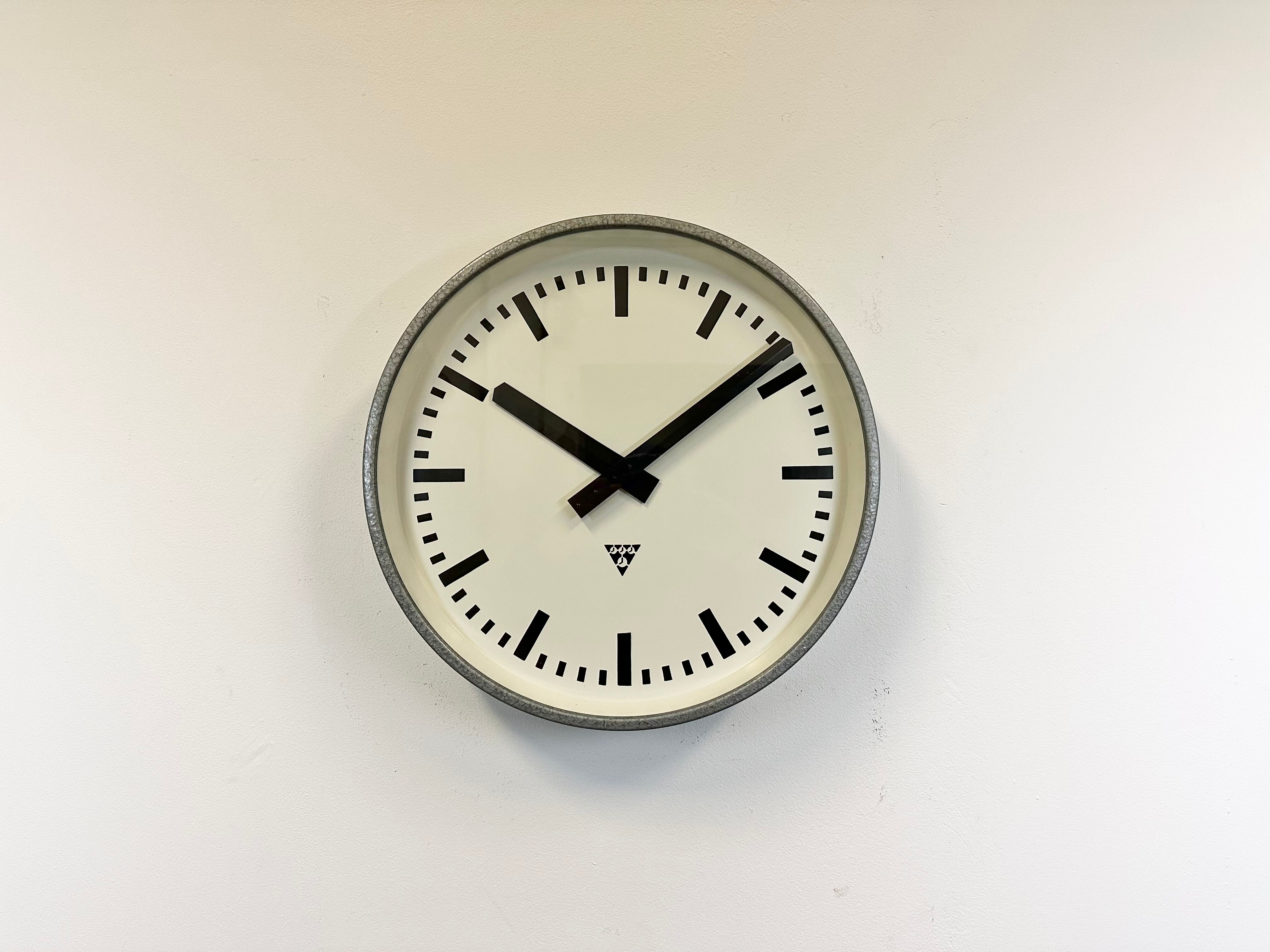 Grey industrial factory wall clock from pragotron, 1960s