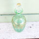 Green and gold flask numbered 23