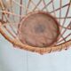 Old tripod rattan plant holder
