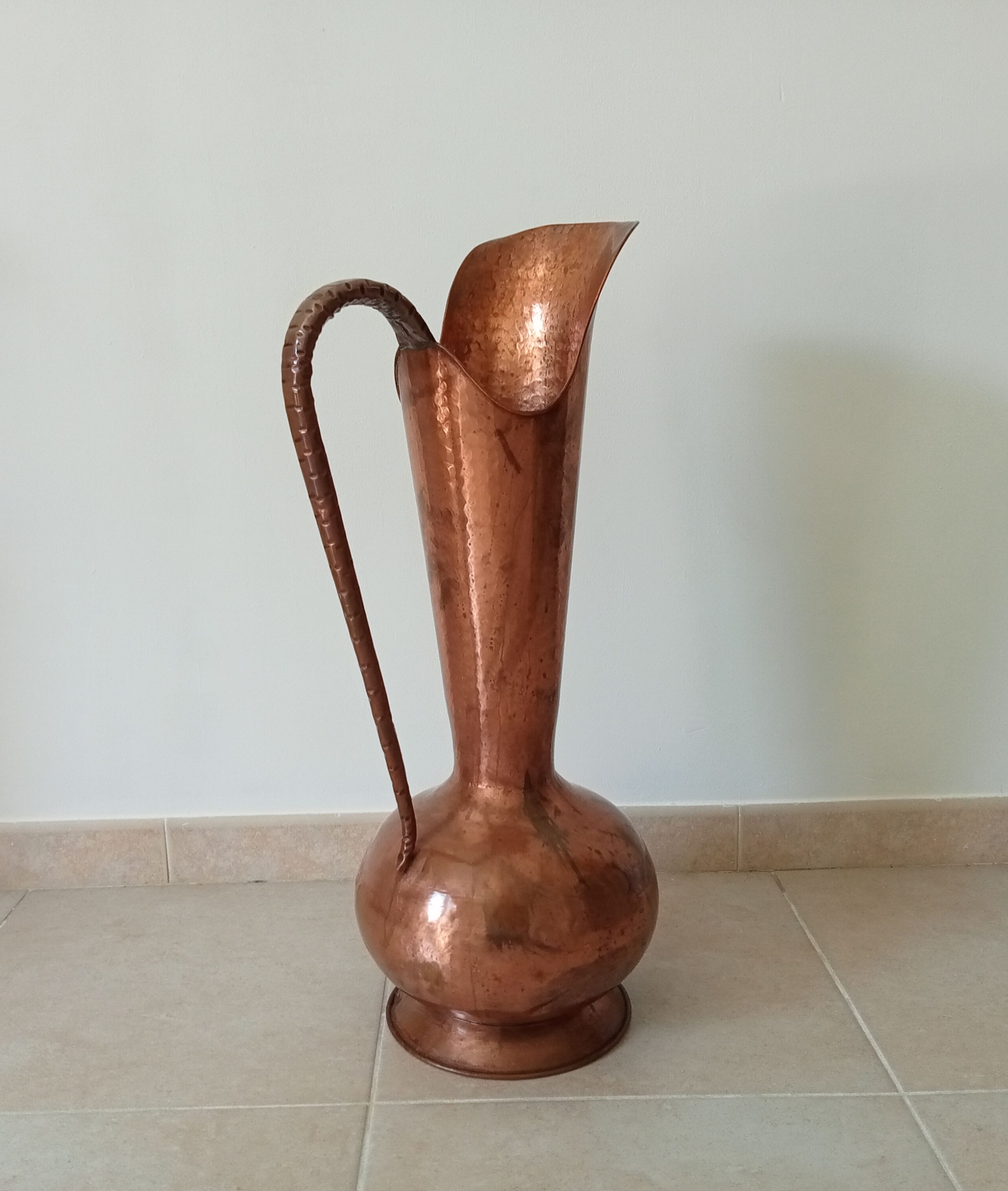 Old italian amphora vase in hammered copper