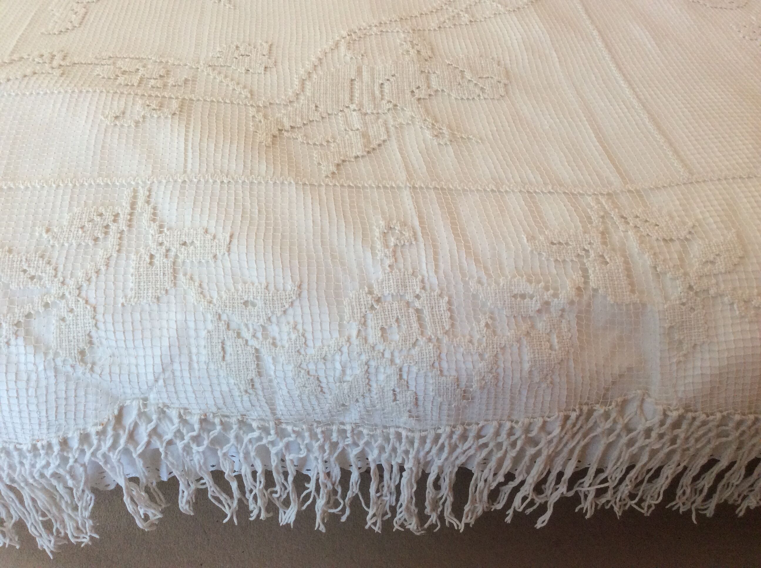 Old bedspread with angel embroidery