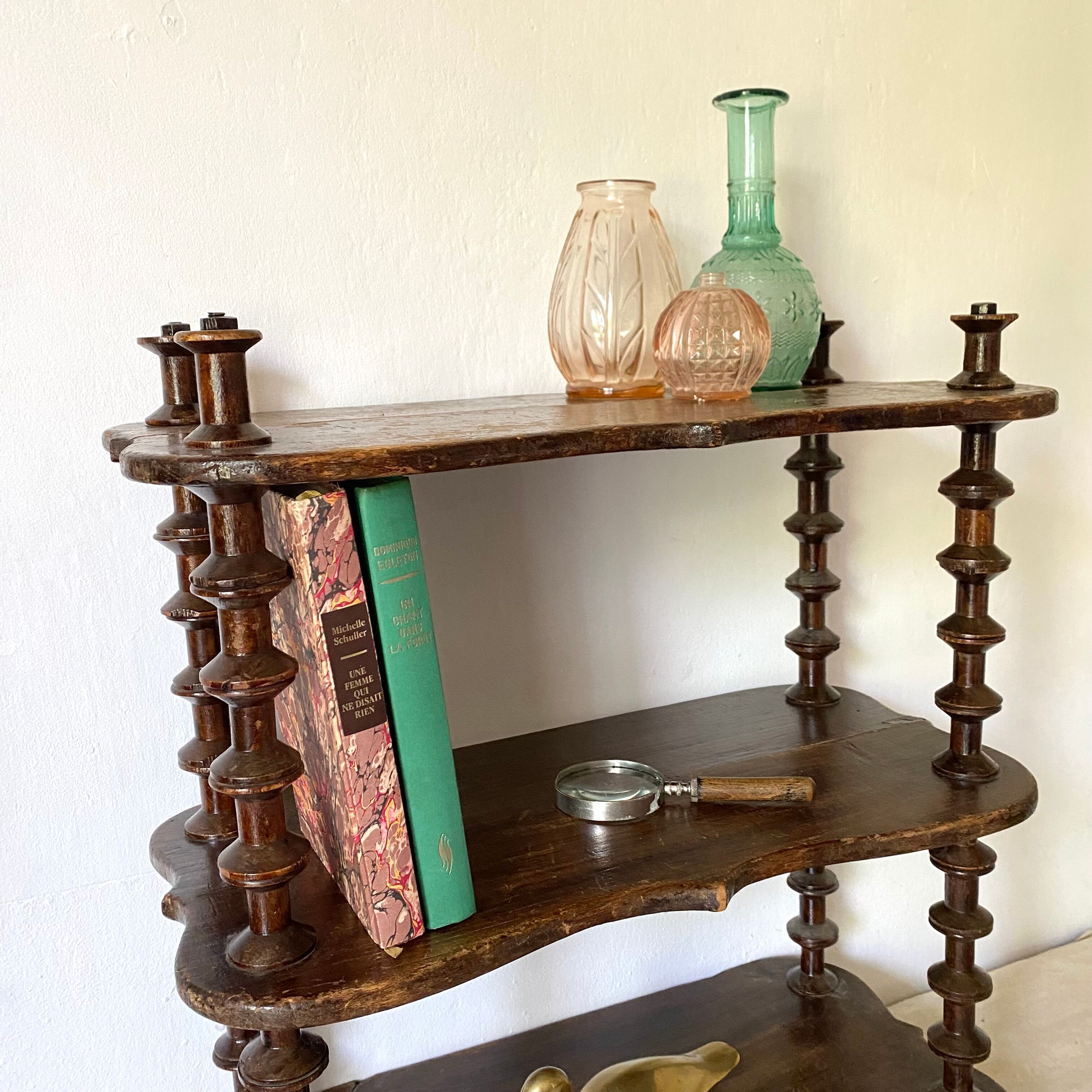 Old shelf in turned wood like reels