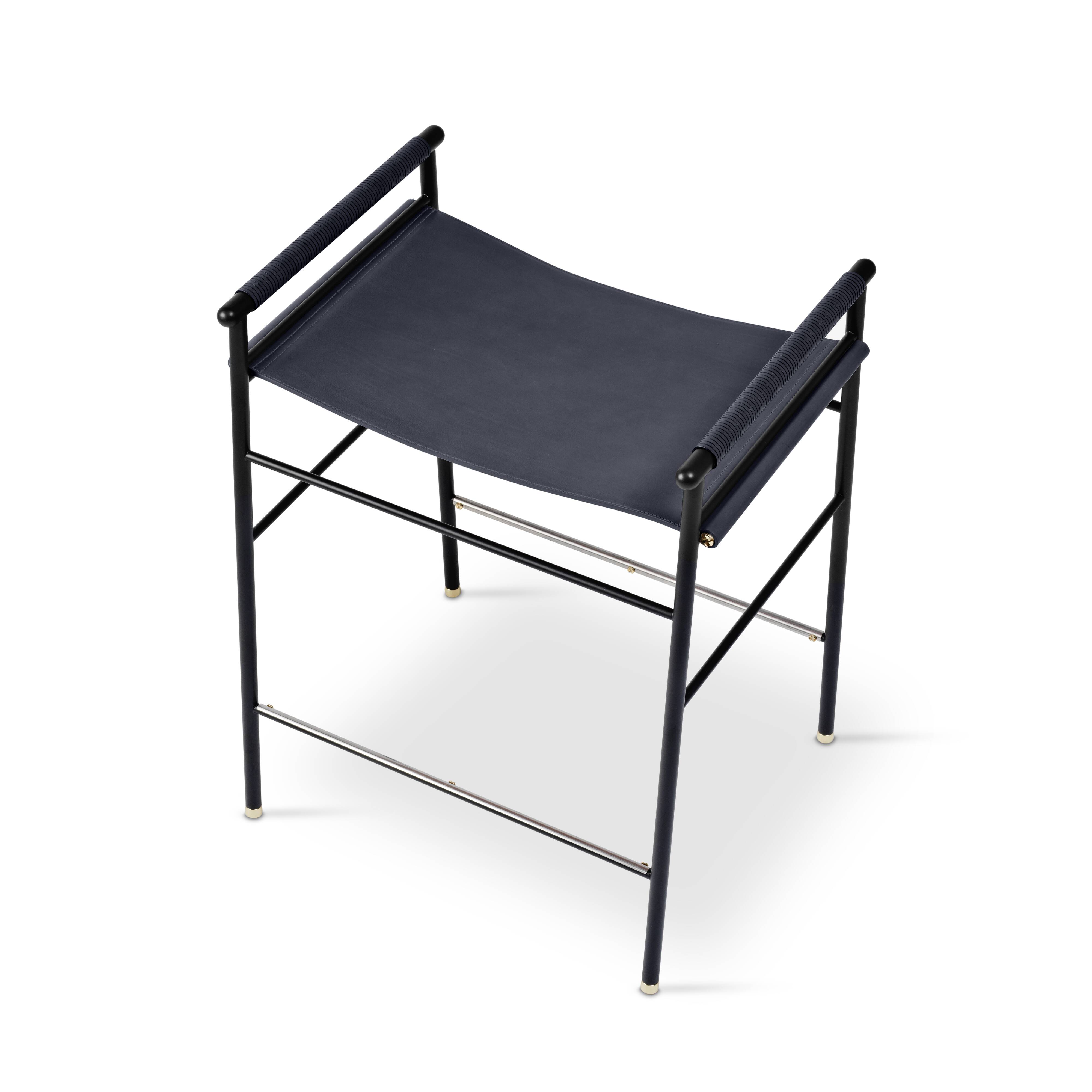 Pair of backless bar stools in blue leather and black metal.