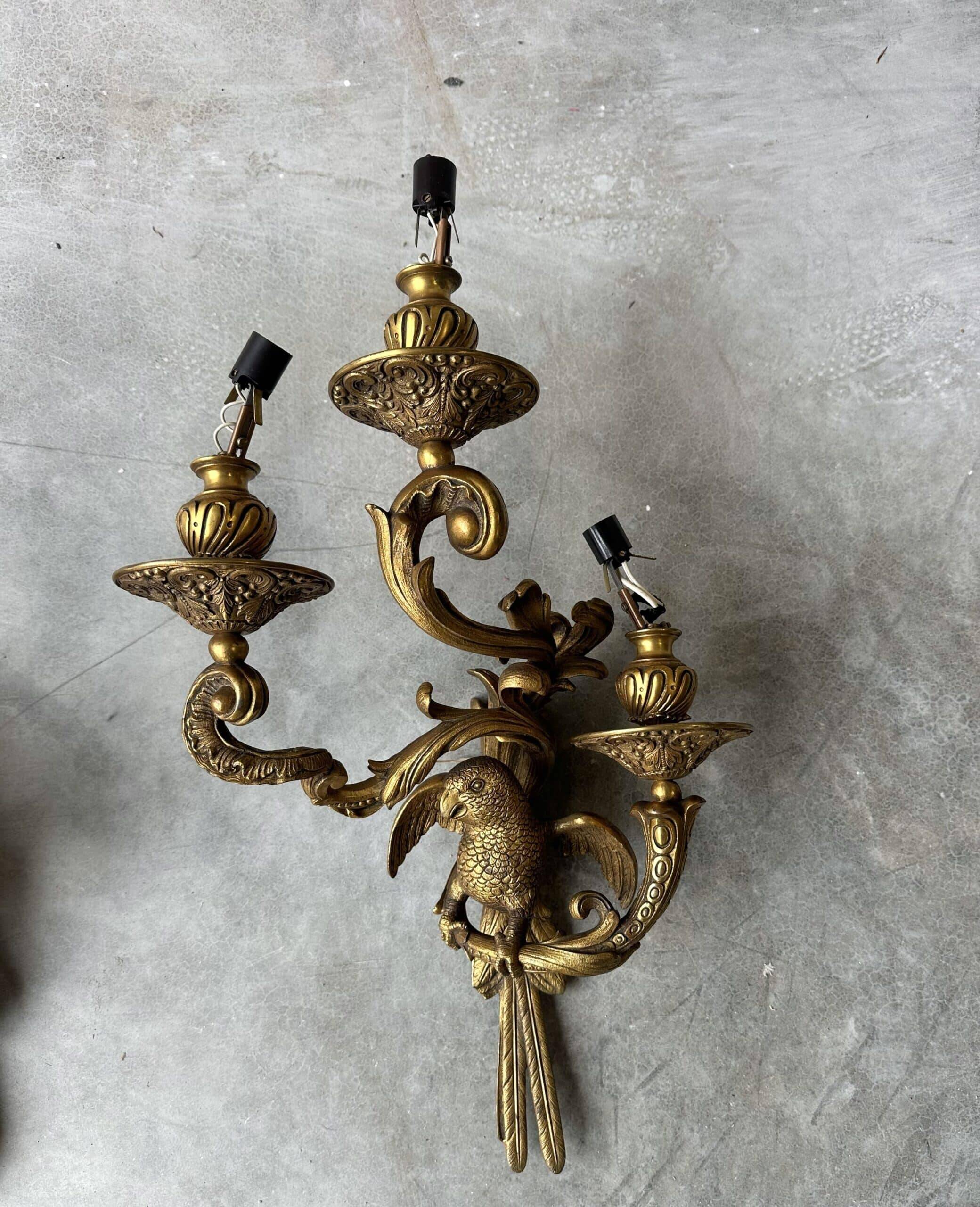 Pair of bronze wall sconces with parrots, early 20th century.