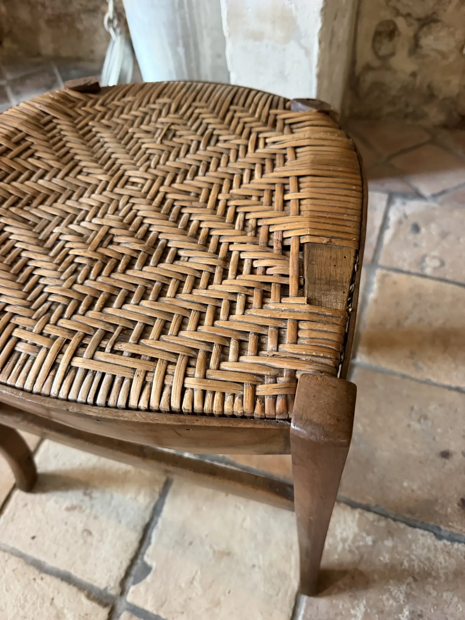 Campaign stool in rattan and wood