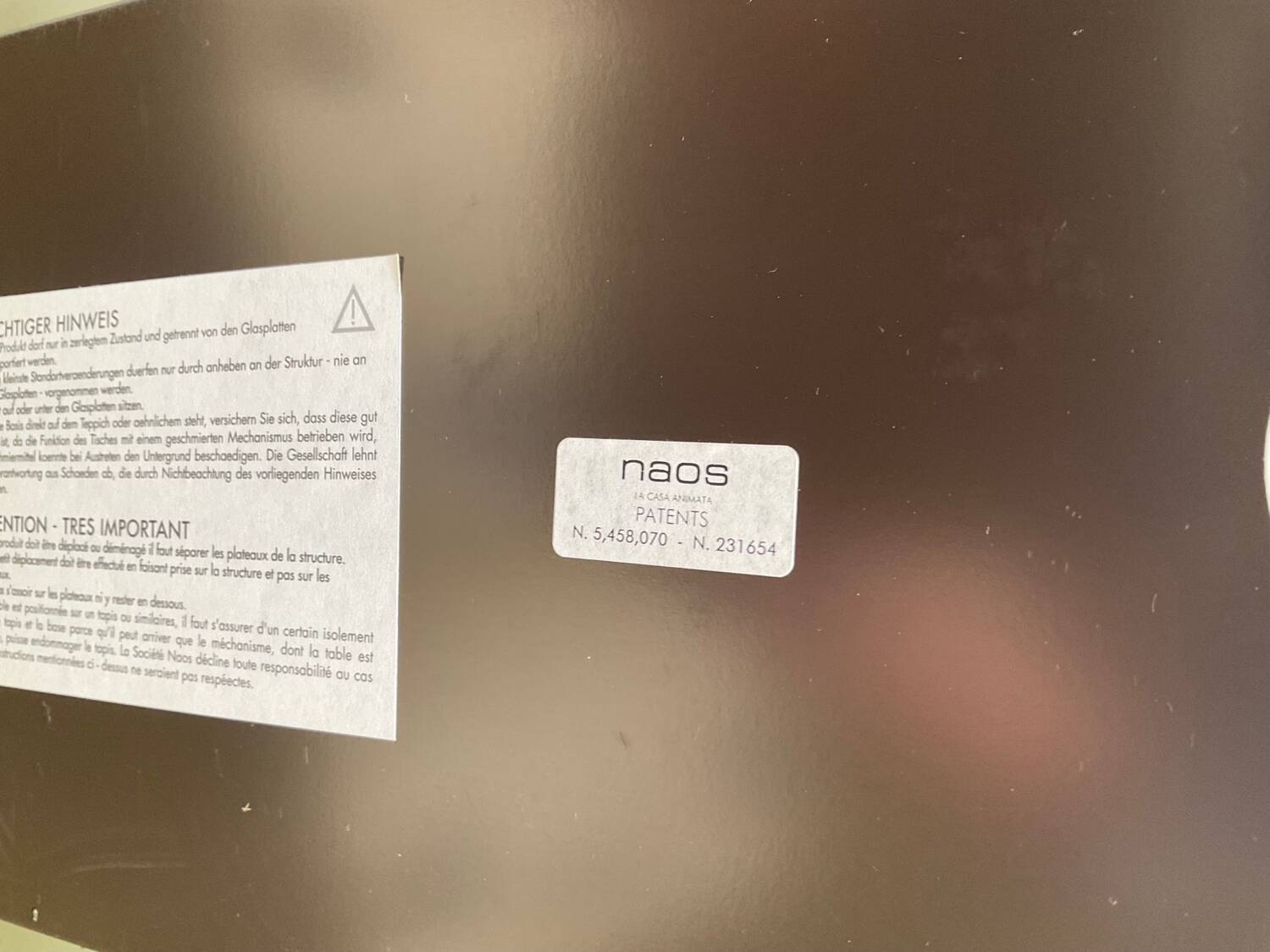 Naos designer coffee table in tempered glass and cast iron